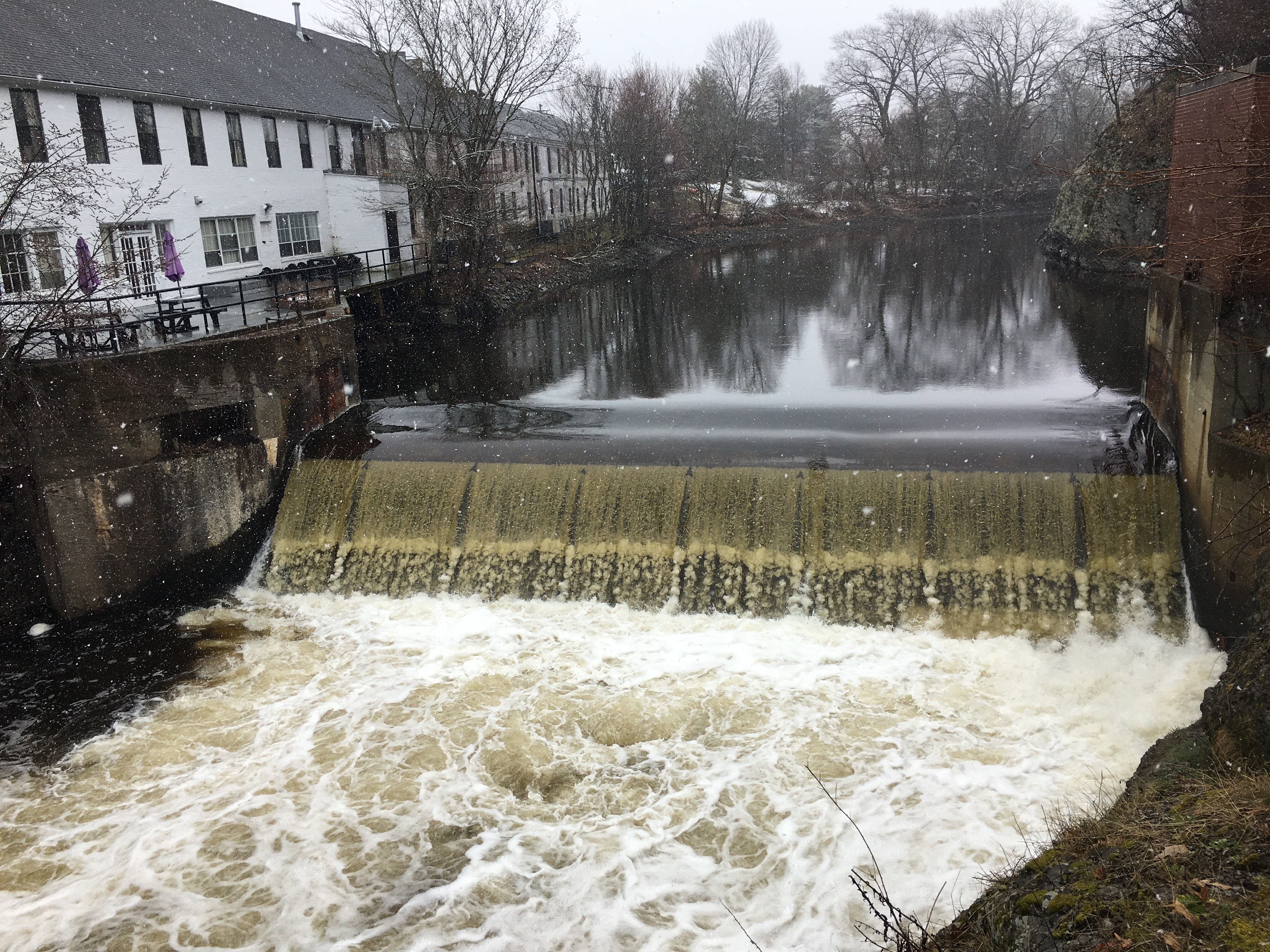 Newton Upper Falls with snowflakes flying